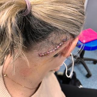 A picture containing person, outdoor, hairpiece, tool

Description automatically generated